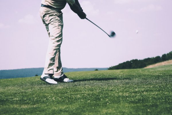 person golfing